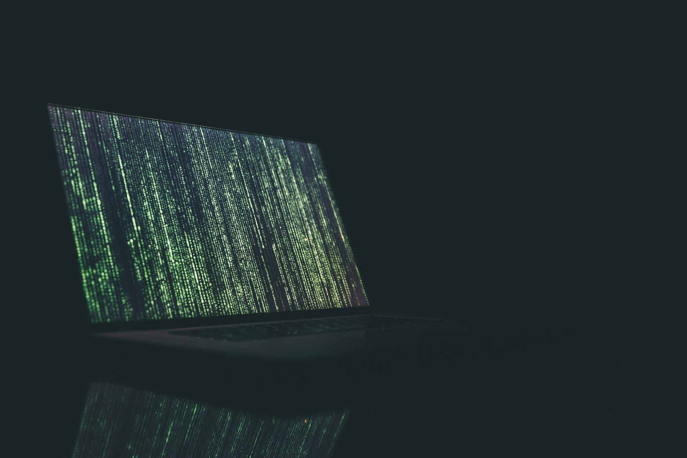Green monospaced characters scrolling down a black screen in tight columns