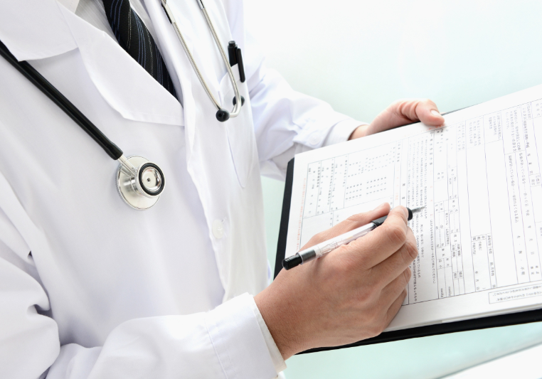 Medical documentation and roadway incident records on a desk